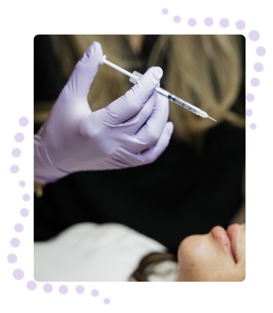 A healthcare professional administering a facial injection to a patient.